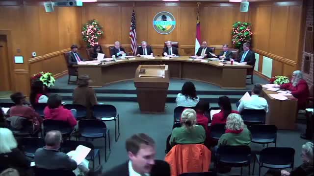 Council recognizes long‑time clerk on her retirement; mayor reports a nearby barricade incident