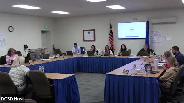 School board approves higher‑deductible stop‑loss option after long debate on risk and savings