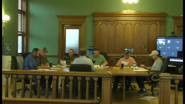 Puget County approves $414,972 purchase of John Deere motor grader, authorizes trade‑in