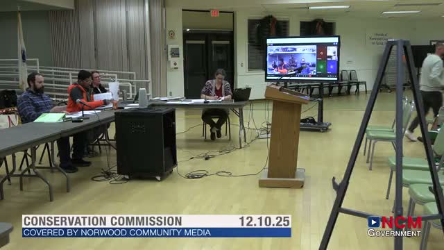 Home Depot works with Norwood to clean and fence wetland area behind store