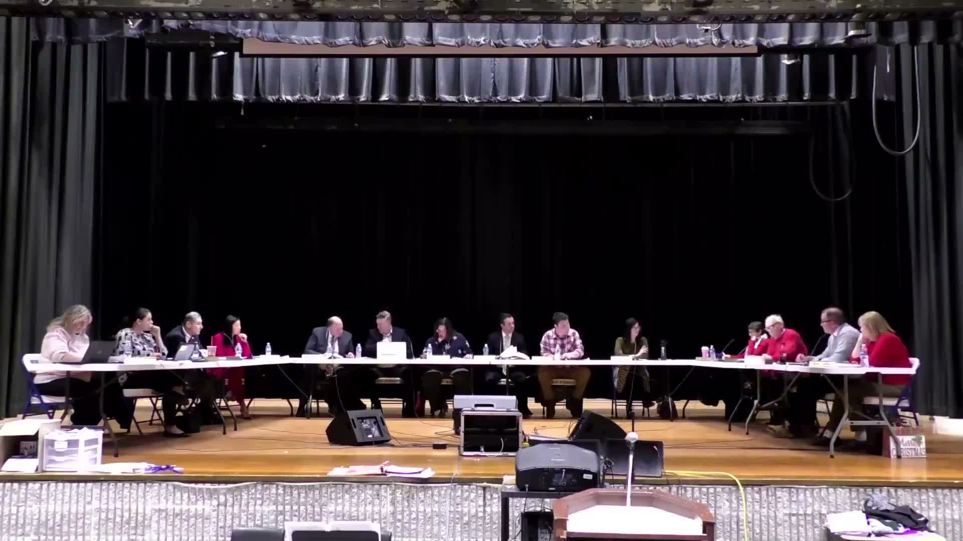 Board tables stop‑loss insurance decision, calls Article 10 meeting with union