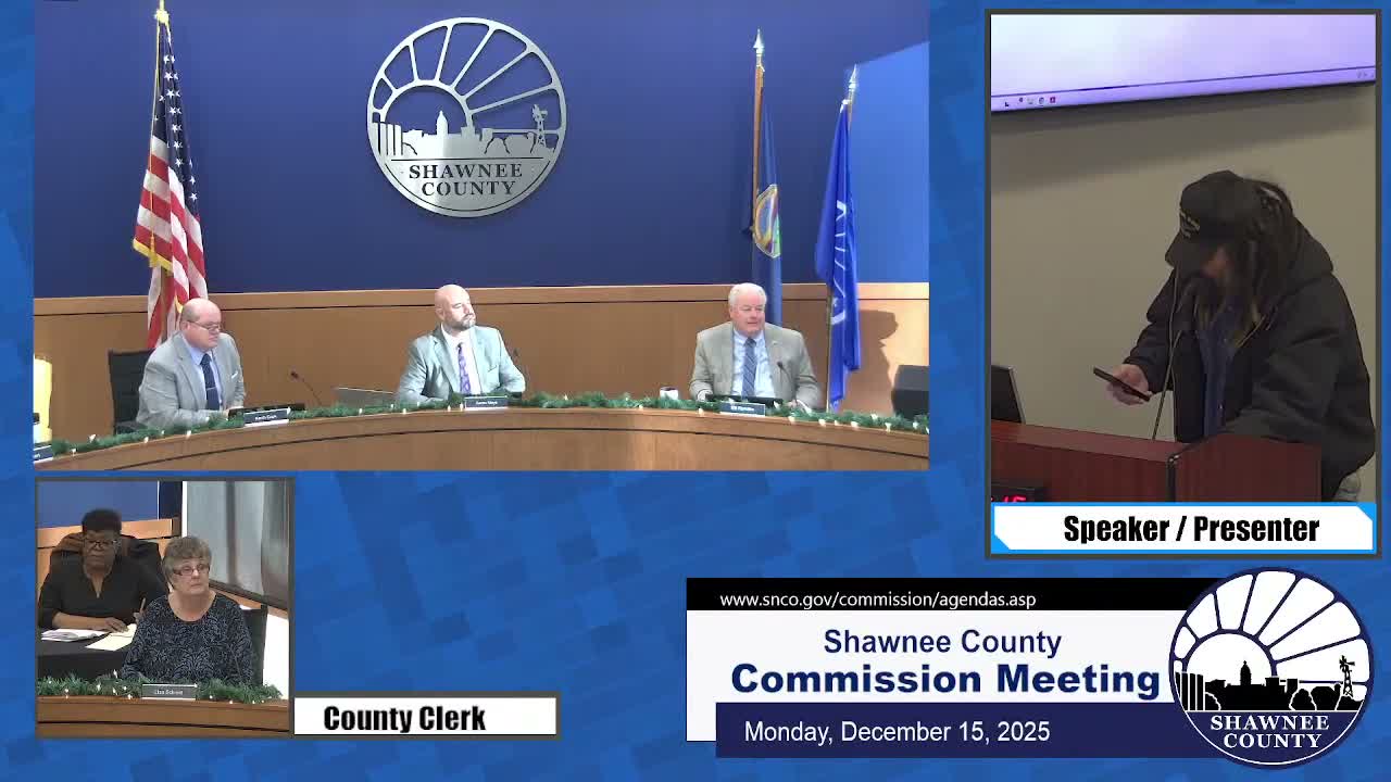 Dr. Justin Spies tells commissioners he has filed federal suit against Topeka library and employees