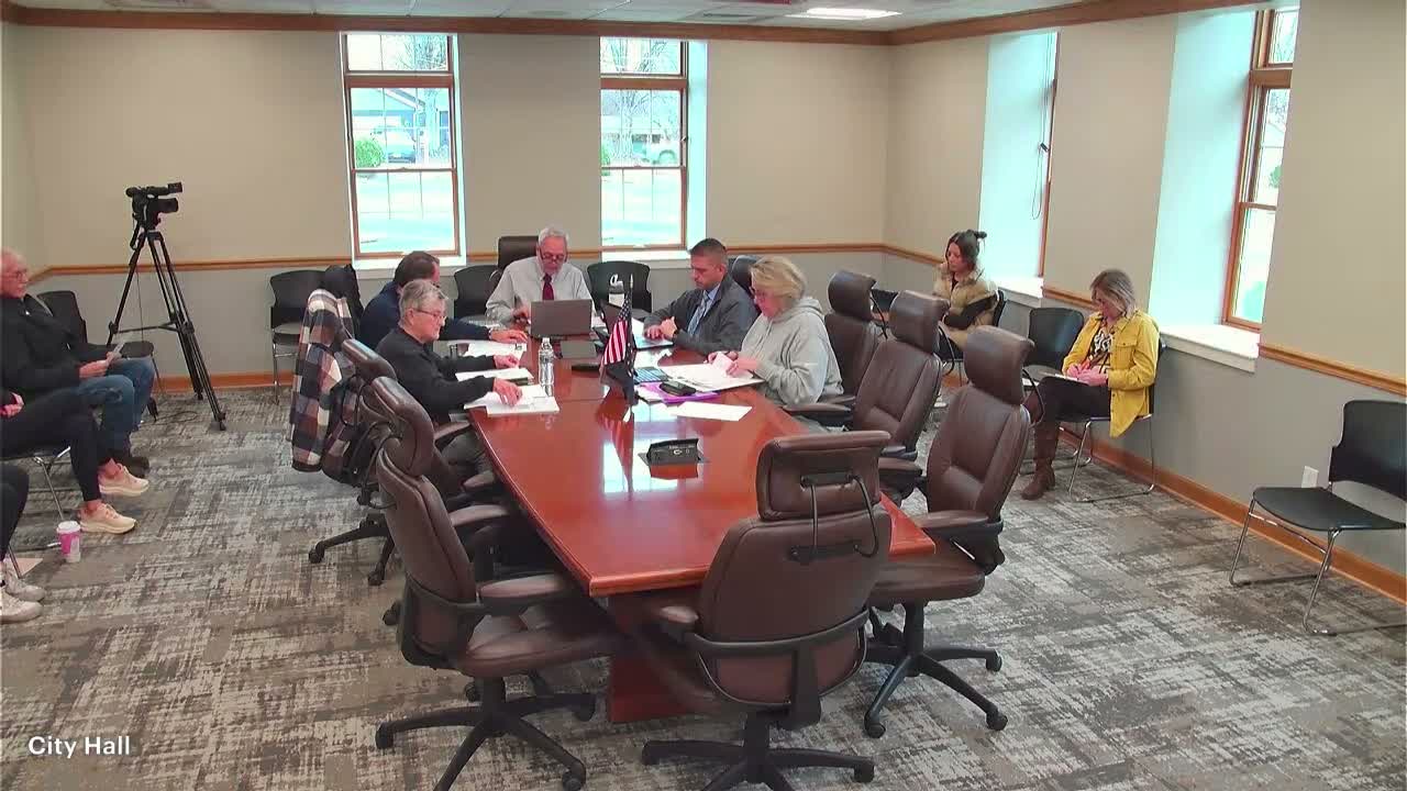 Board approves drive‑through work — contingent on written layout to verify queuing improvement