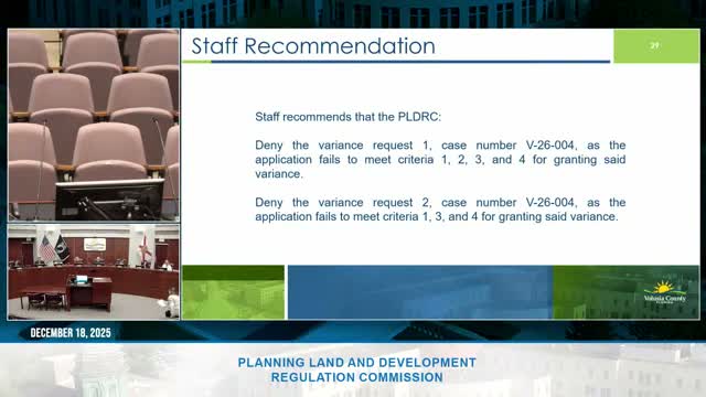 Commission permits front‑yard solar array after staff finds screening adequate