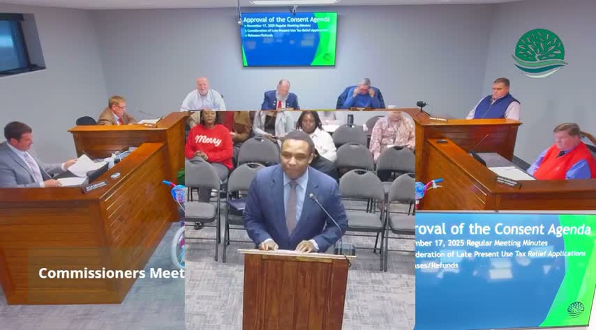 County presents flag to veteran, honors finance officer and notes holiday events