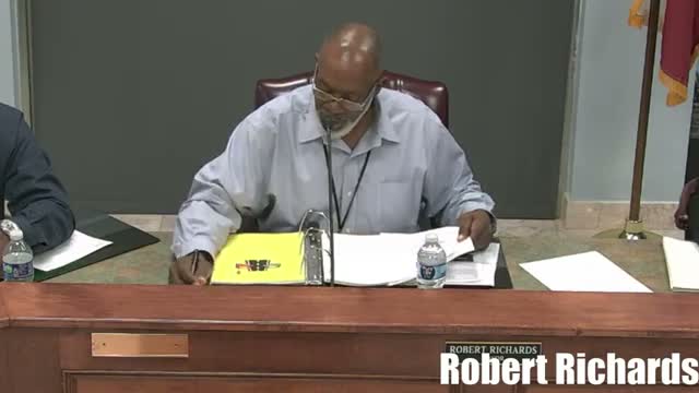 Residents tell Brookshire council a tire shop tarp and overgrown trees are blocking sightlines at FM 362/FM 359 intersection