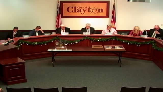 Clayton Council adopts emergency wage ordinance and approves three year‑end resolutions including $630,000 design contract