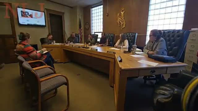 Commission discusses moving extension executive secretary to University employment; board hears cost, benefits and timing