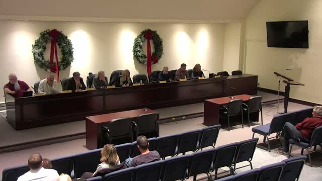 City council adopts salary ordinance amid public objections