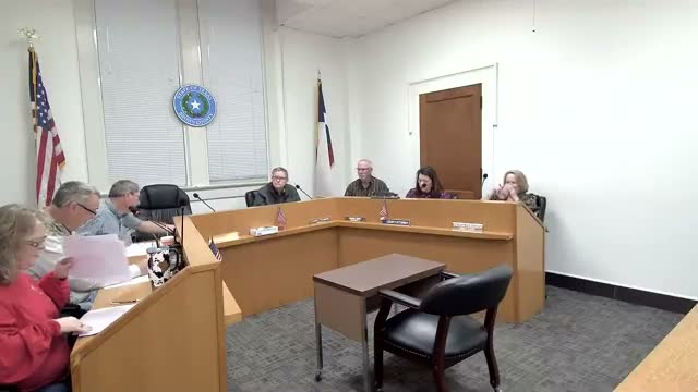 Commissioners discuss moving $807,467.19 year‑end funds into CD for capital‑defense cap