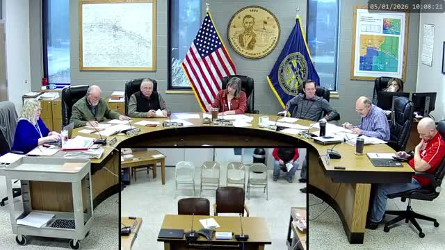 Commissioners direct staff to draft two salary resolutions after extended debate