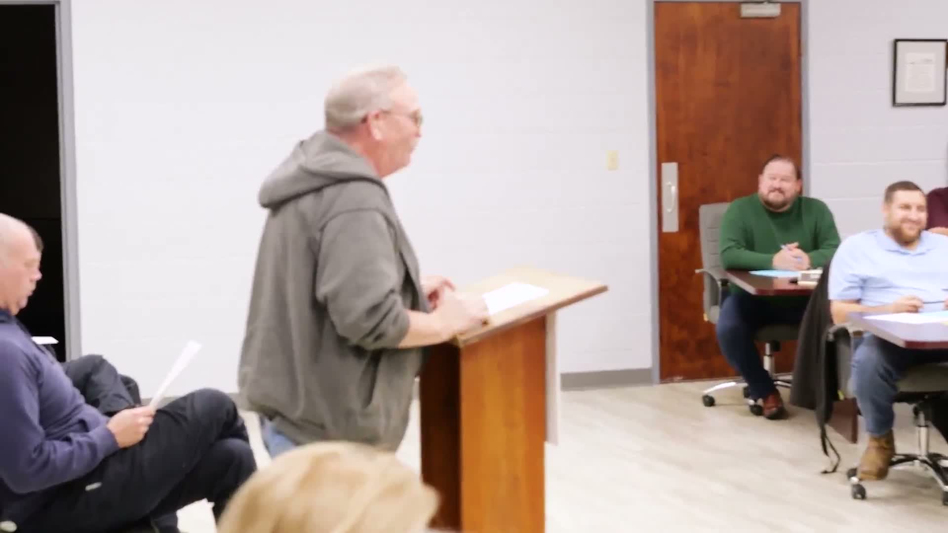 Resident praises city signs and urges repair of Monroe and Walnut potholes