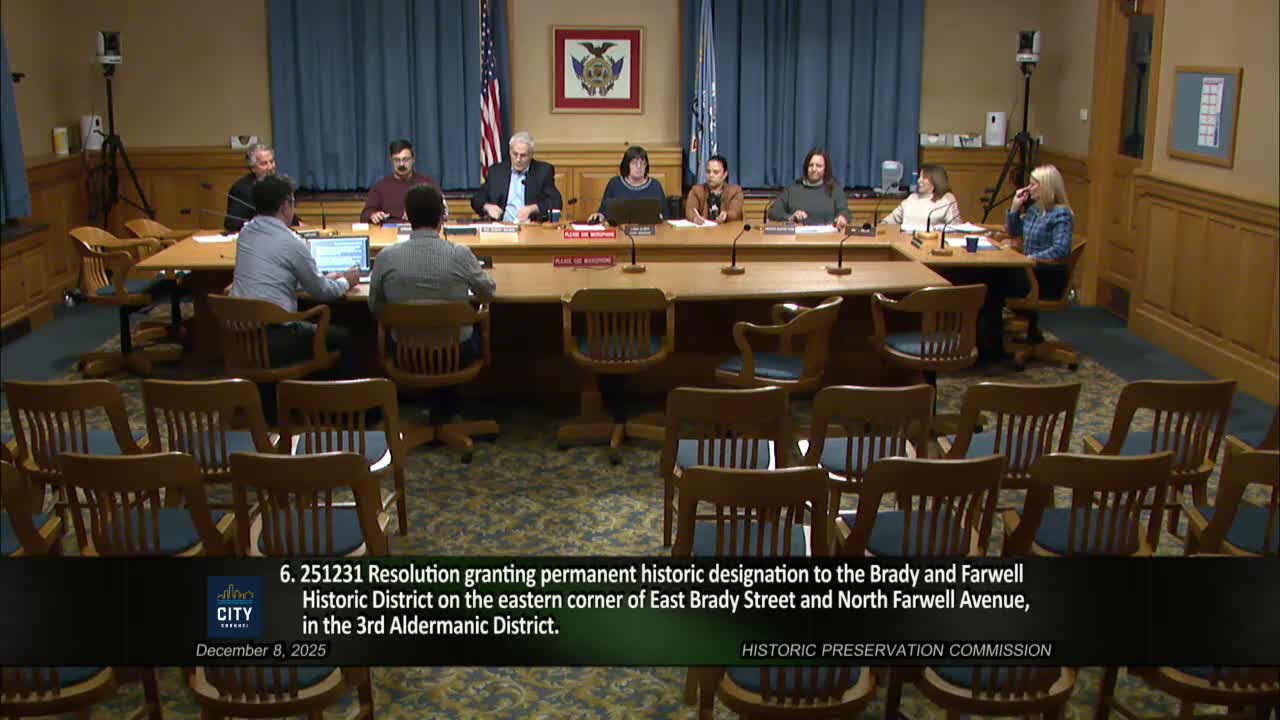 Historic Preservation Commission: holds storefront design, denies vinyl windows and synthetic roof product; approves elevator shaft removal; Wells Street canopy