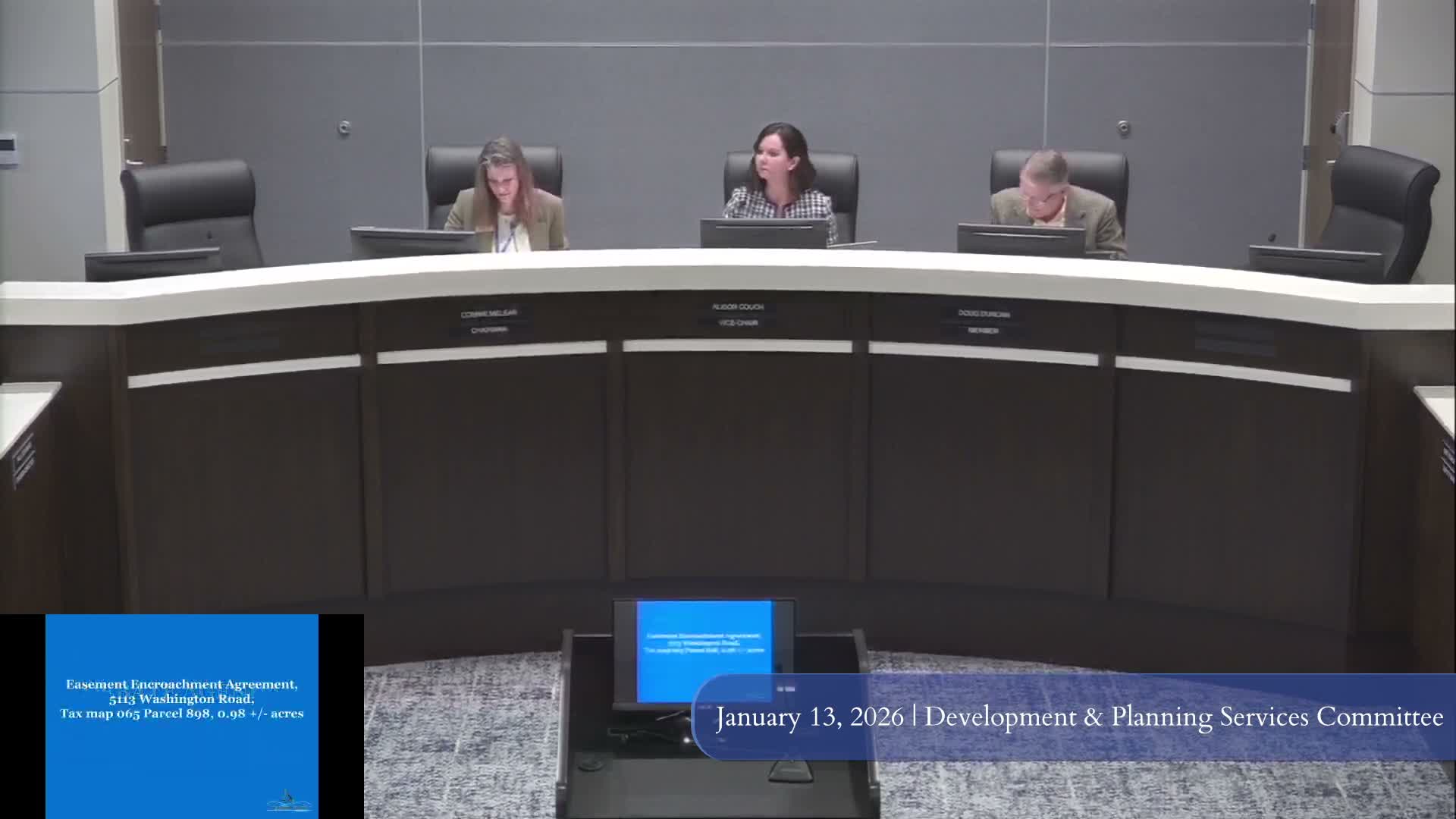 Development planning committee approves easement encroachment allowing Wendy's trench drain at 5113 Washington Road