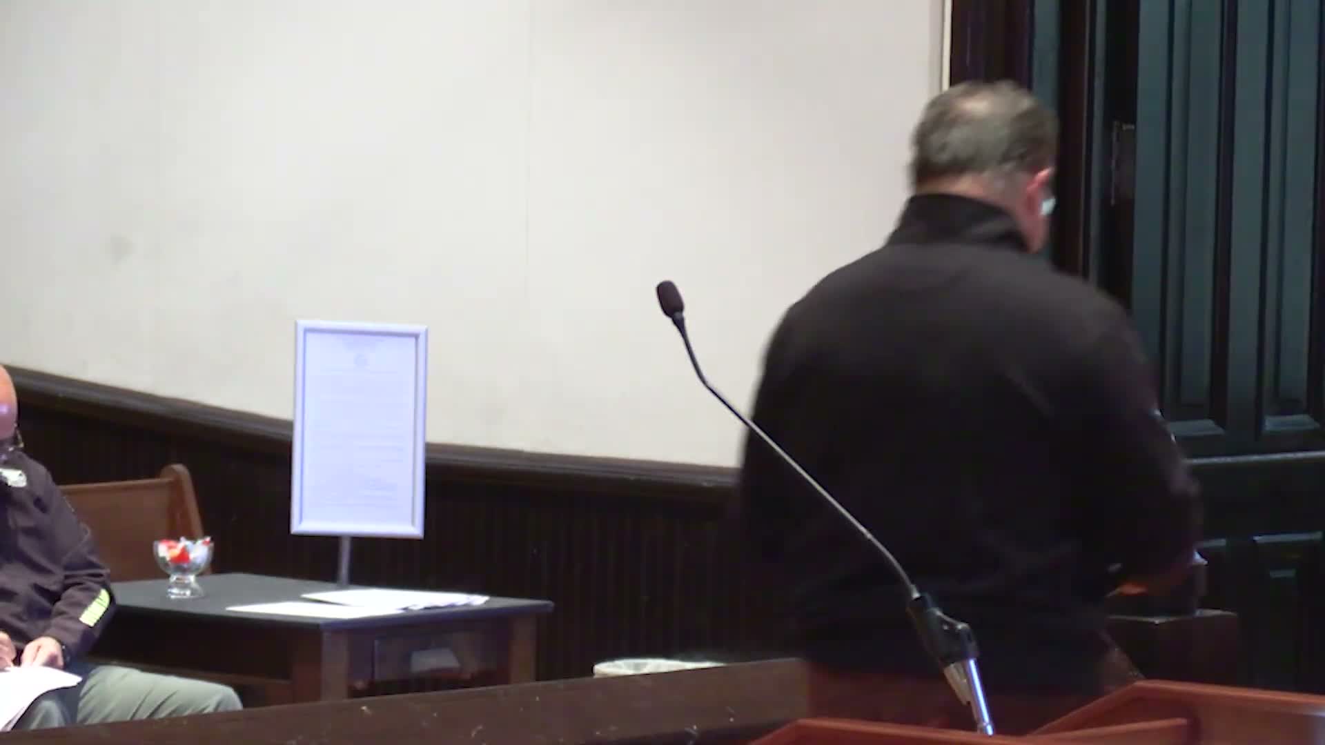 Commission moves $7,800 indigent-burial line to coroner's budget; statute requires funding when standards met