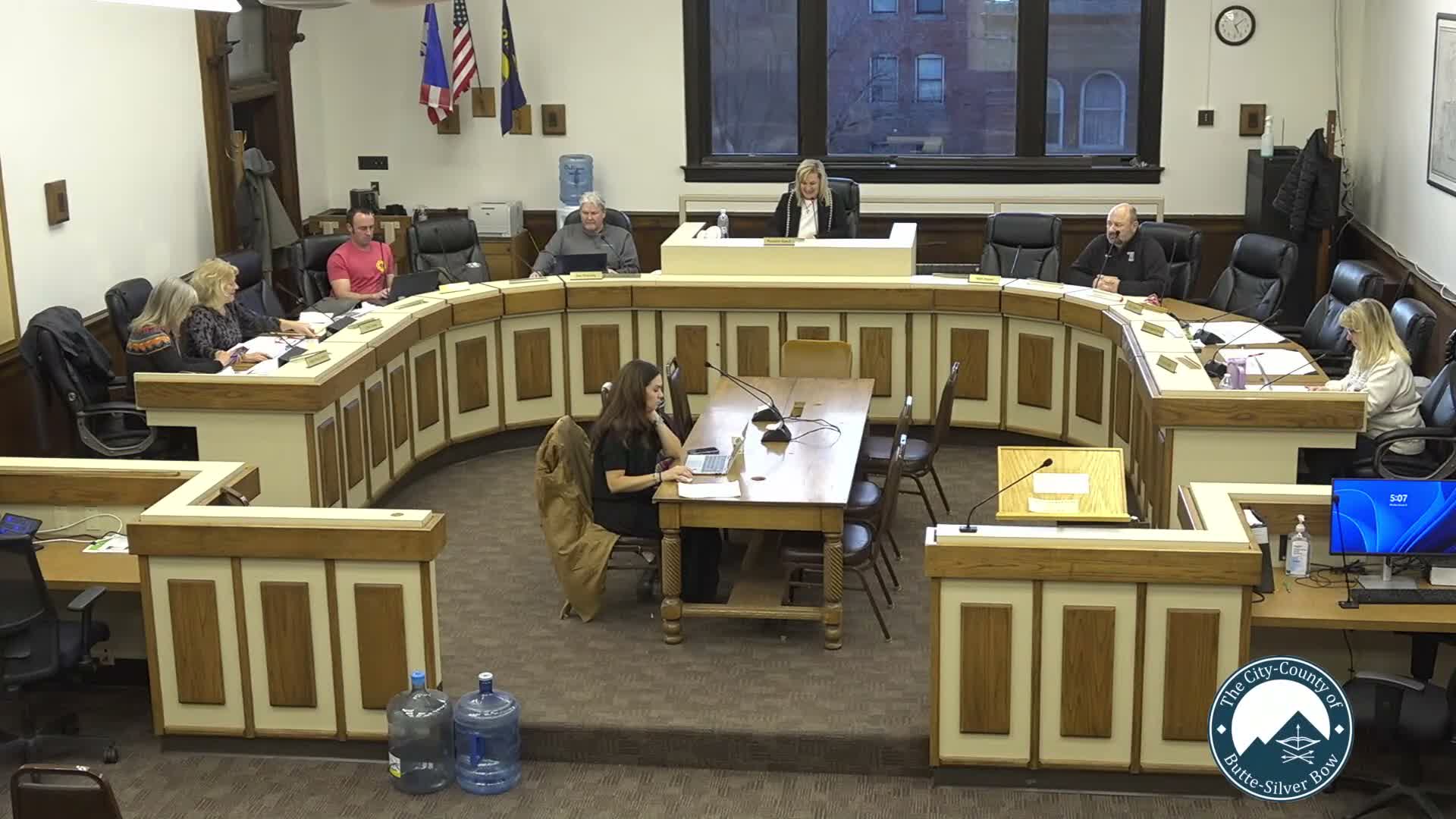 Commission debates charter specificity: director vs. manager titles and a reclamation department