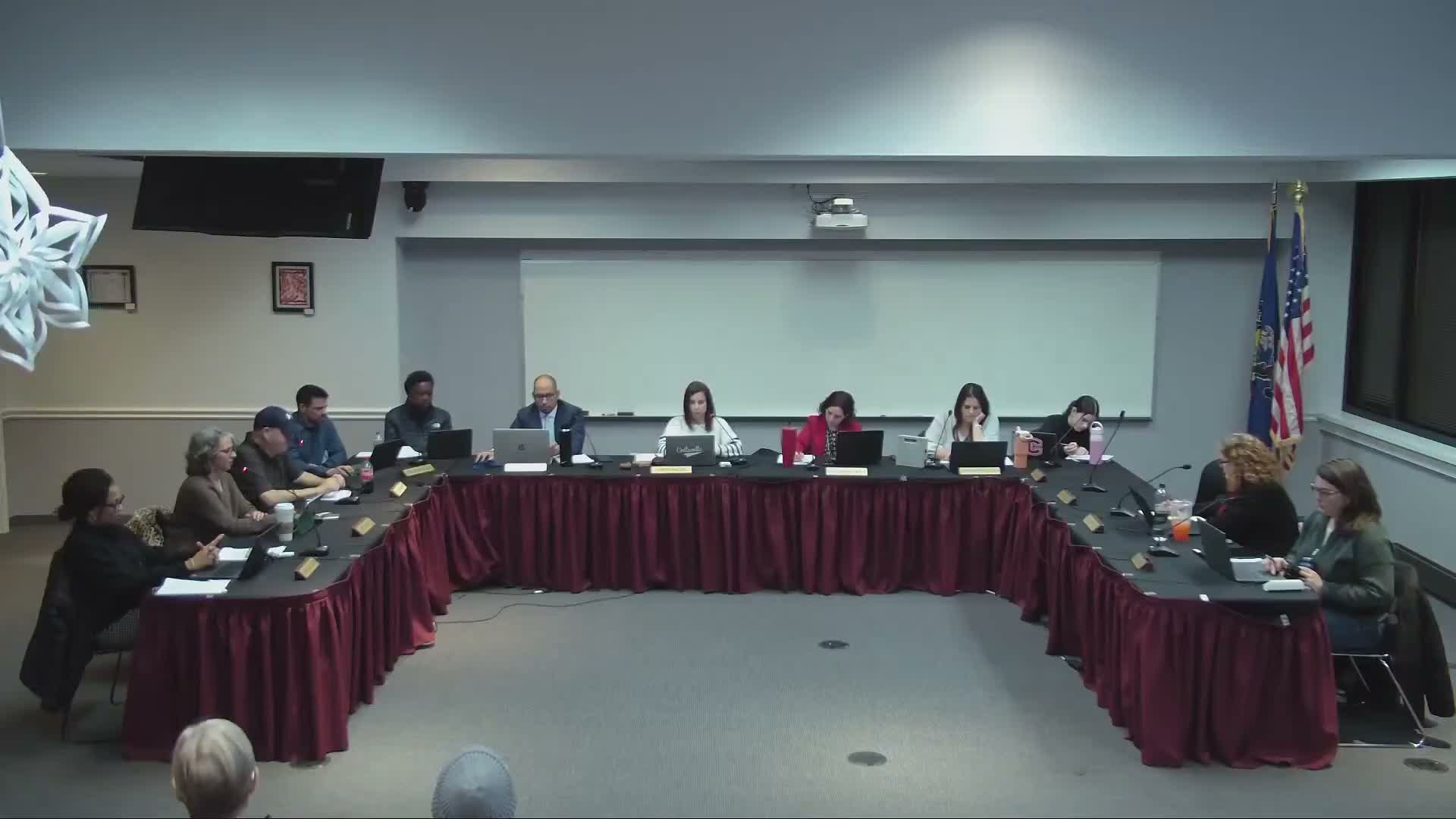 Finance committee advances 2026–27 budget posture, approves grants and staffing items to full board