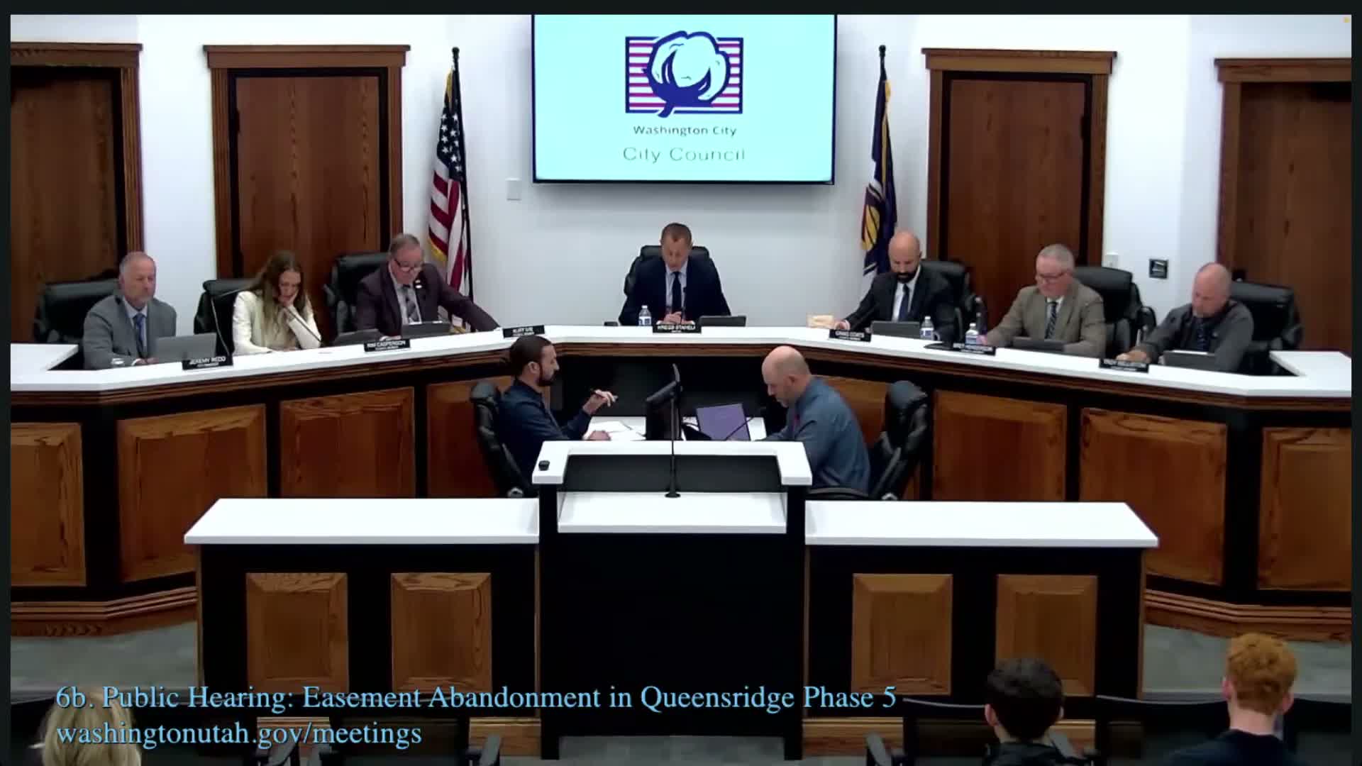 Council approves evaporation pond permit after debate; condition requires zone change and open‑space replacement