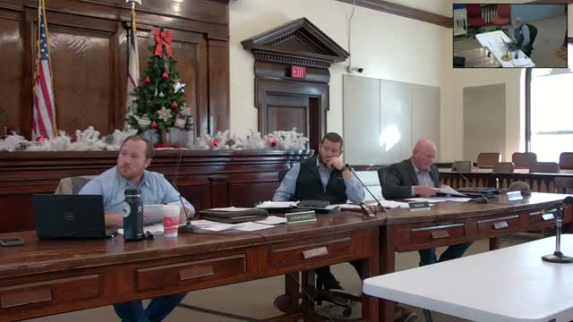 Commission discusses large ambulance invoice, approves other invoices