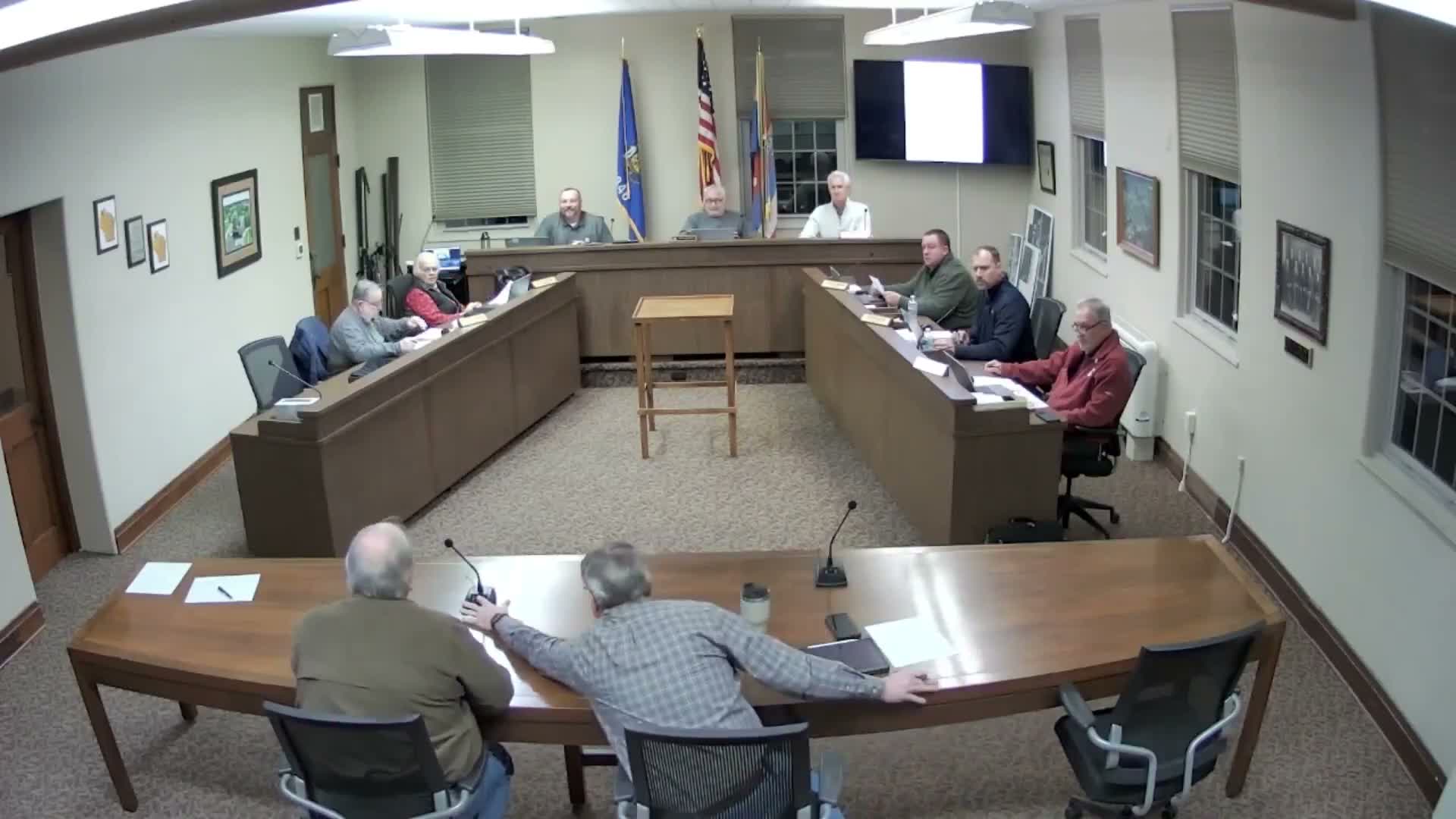 Resident raises garage request for duplex property; planning commission recommendation to treat duplexes like single‑family homes to advance to public hearing