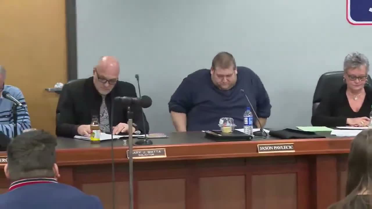 Board approves consent agenda; one member objects to AIU website and copier spending