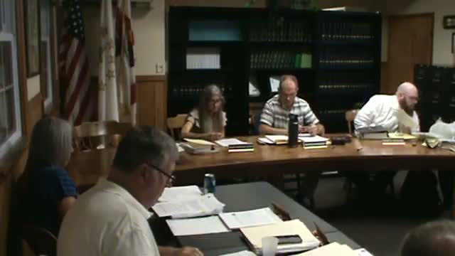 Neighbors press council over wood‑chipping operation and worsening runoff in conservation zone