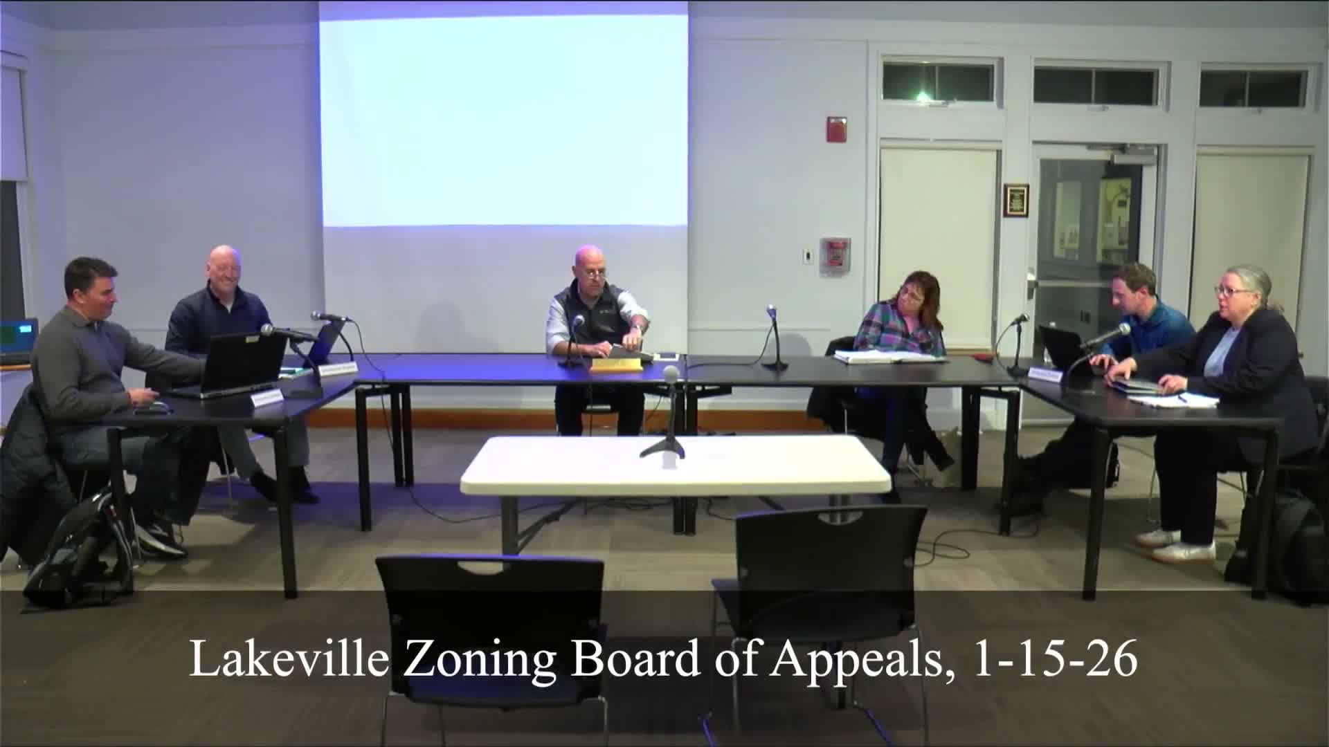 Lakeville zoning board delays appeal over alleged commercial firewood operation at 11 School Street