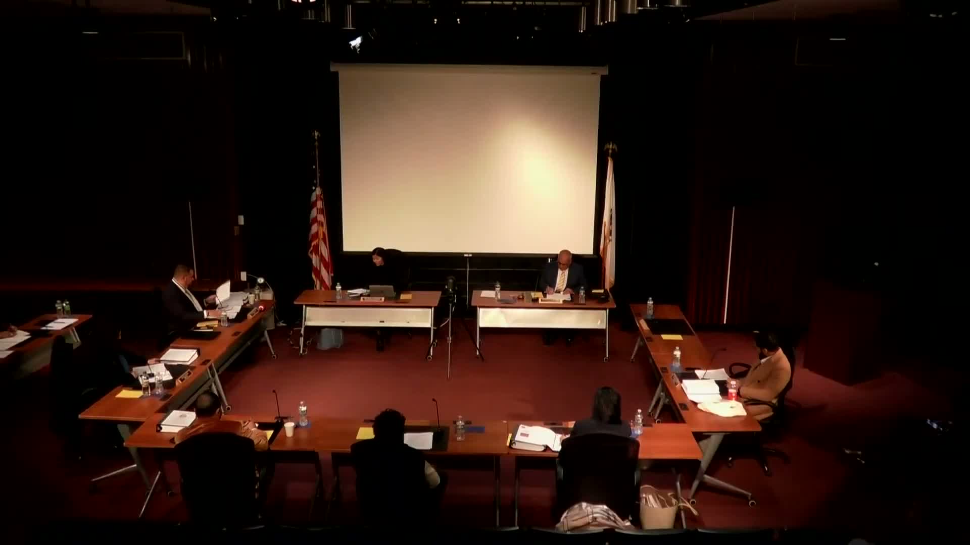 Committee refers review of nonprofits and district-related accounts after debate over recusal motion