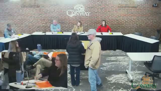 Board clears multiple downtown window graphics; several required minor sizing adjustments before permitting