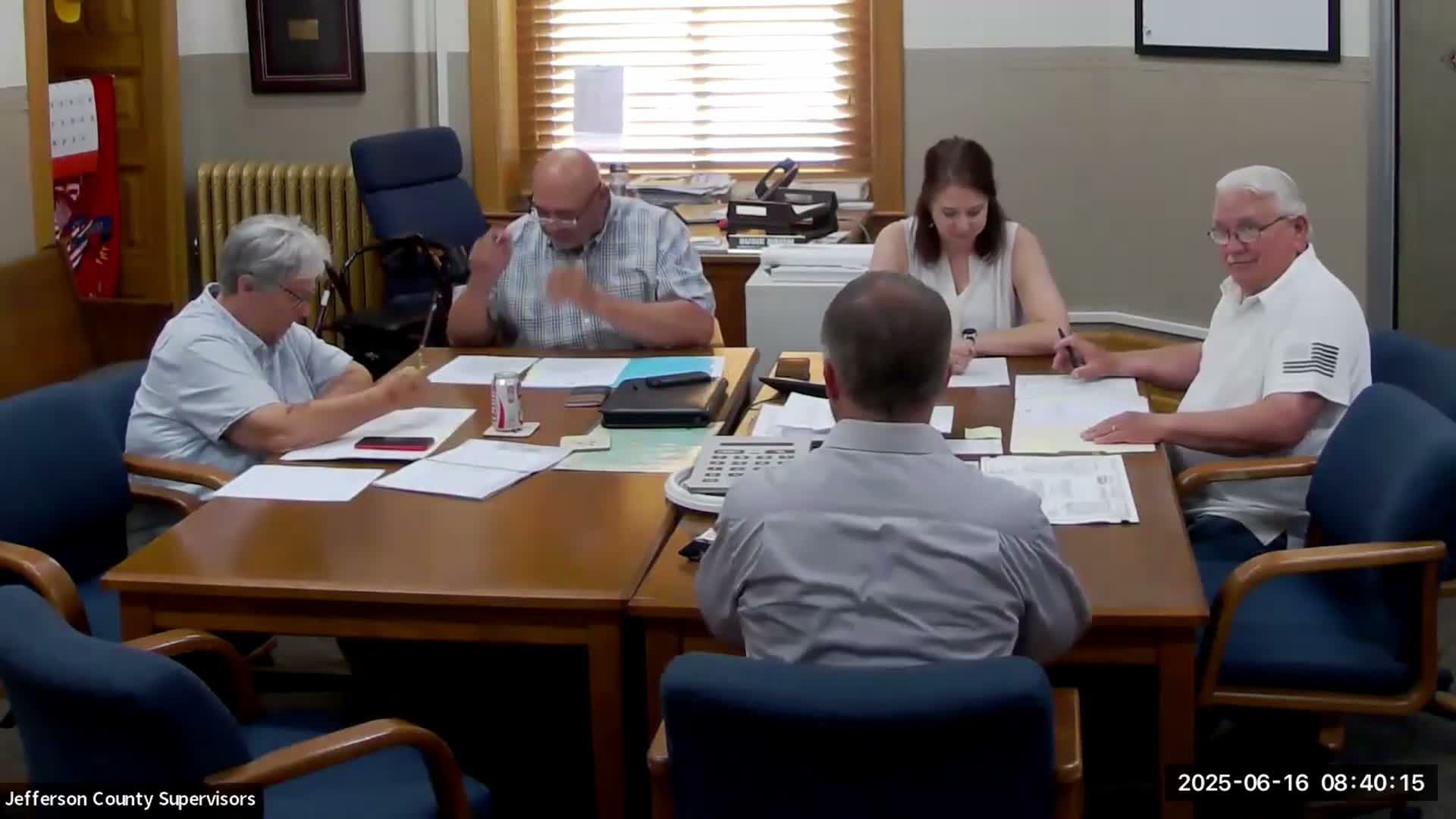 Residents report vehicle damage after county chip-seal work; county to broom, adjust sand and offer cleanups