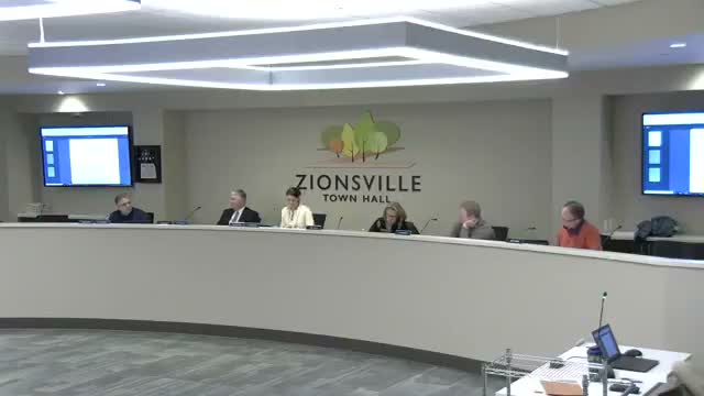 Zionsville staff seeks BZA guidance on counting driveways toward lot‑coverage; enforcement suspended