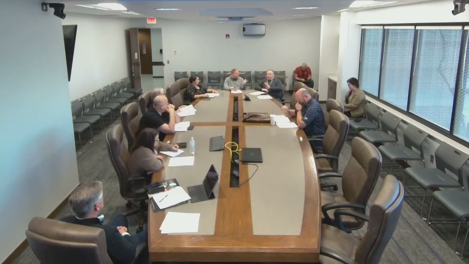 Norman committee considers using freed contract funds to hire in‑house economic development staff and pursue $25M grant