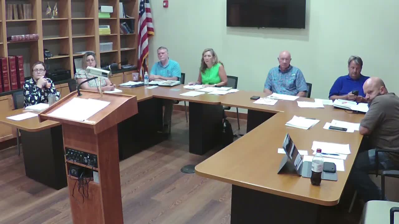 Commission hears proposal for evidence/clerk role, asks county attorney to review pay-arrear question