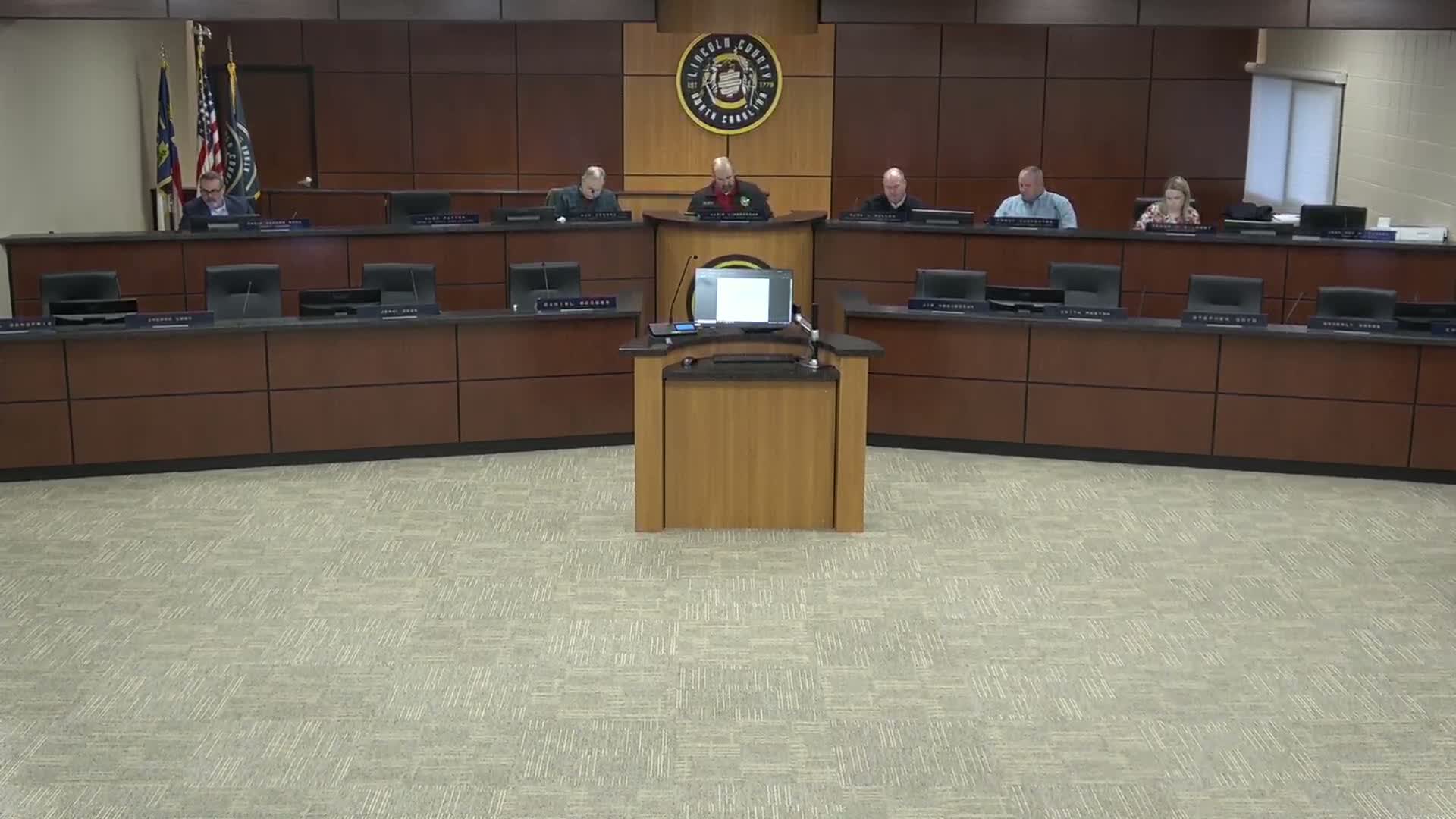 Commissioners accept $5,000 library scholarship; finance director reports midyear revenues