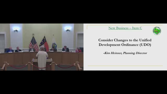 Commissioners table sign-ordinance changes after debate over billboard spacing and setbacks