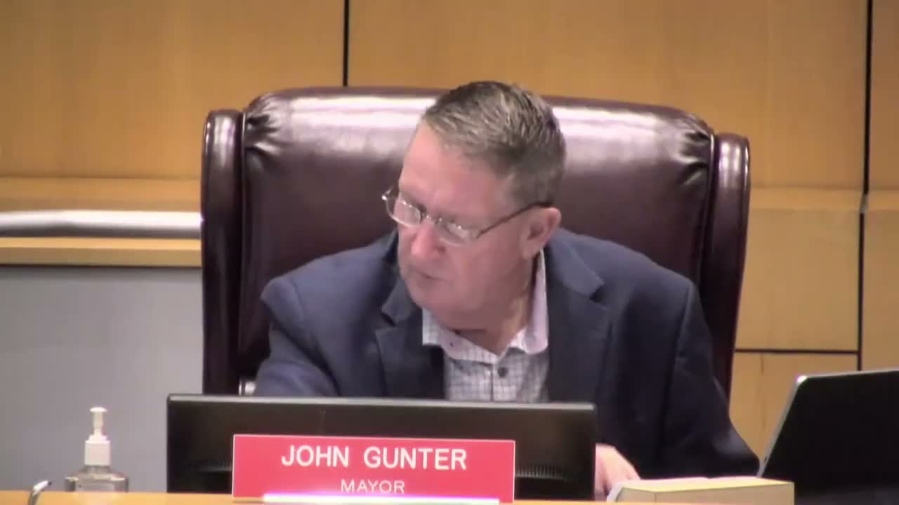 Council debates fence and retaining‑wall changes; staff to convene industry working group