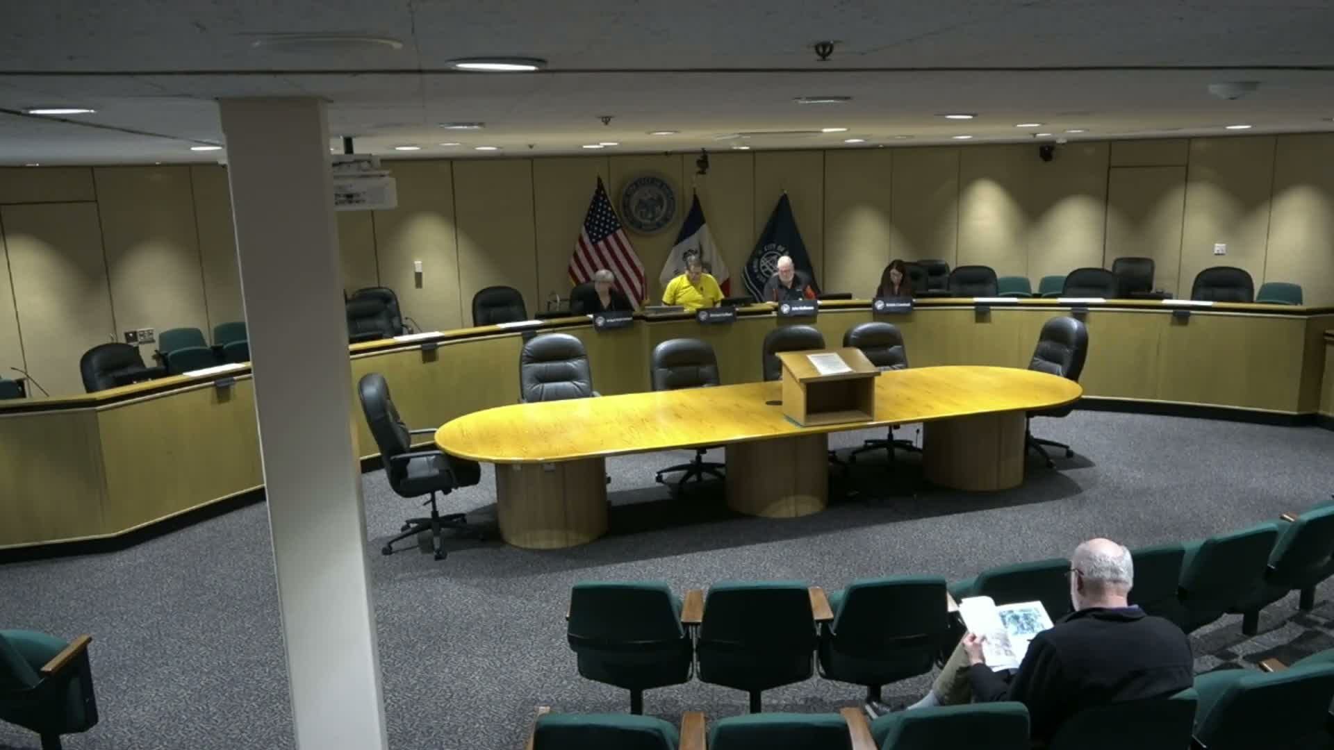 Davenport Zoning Board approves parking-lot and auto-dealership special uses; denies oversized garage request