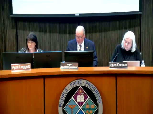 After neighbor negotiations, council replaces published ordinance and approves rezoning for property at 2620 Alexander