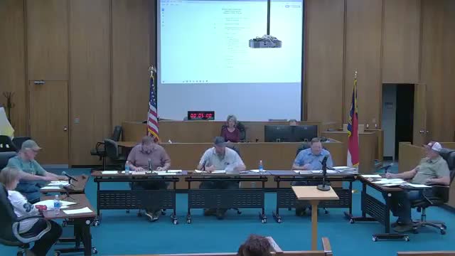 Commissioners appoint clerk and recreation board member; approve interim manager contract in closed session