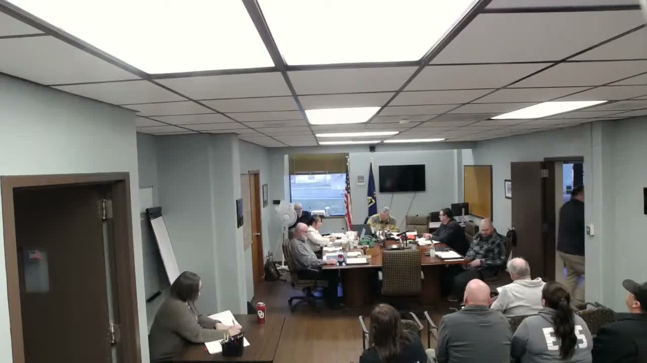 Commissioners authorize grader purchase, probe asphalt plant problems and sign Jayhawk bridge agreement