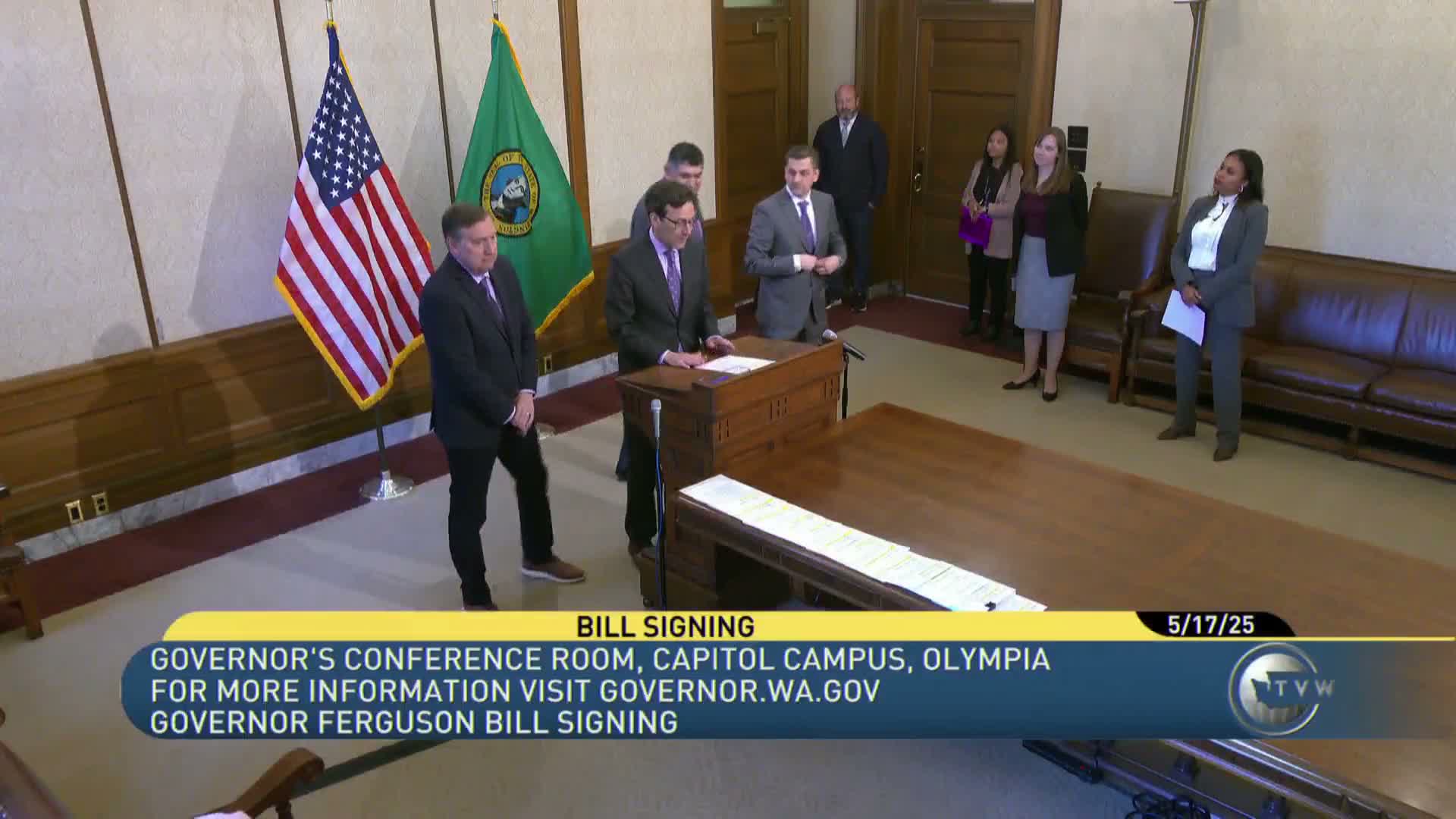 Officials sign 51 bills into law, including election-security and voter-registration expansions