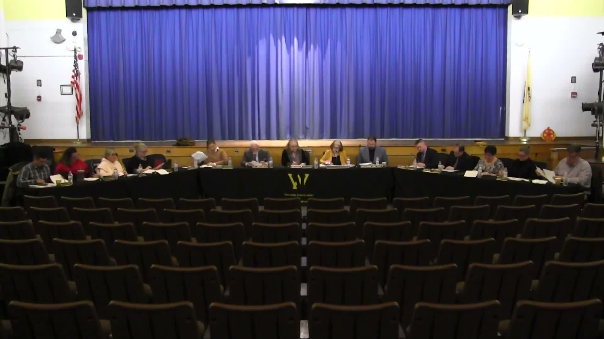 Board approves personnel and operations packages; tables one education item for committee review