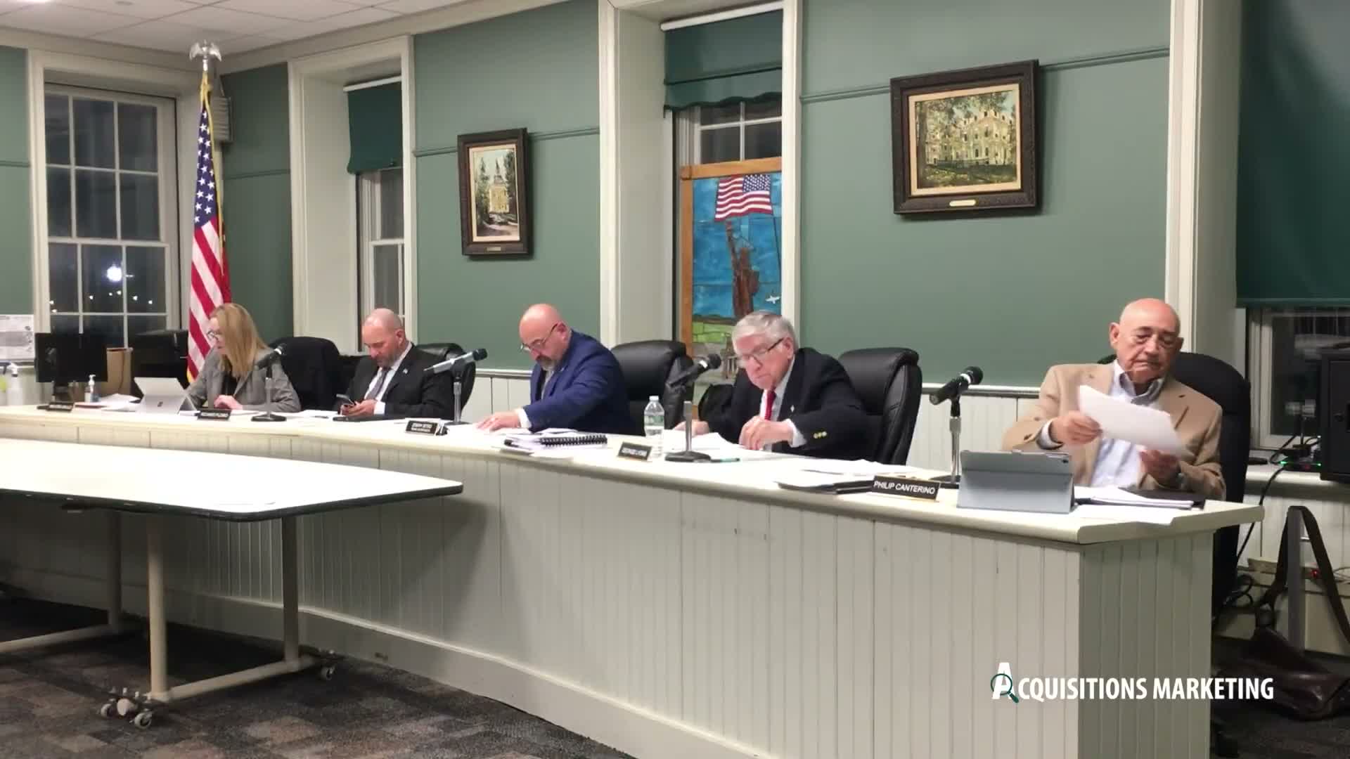 Engineer presents modified parking plan for large event site; board flags floodplain variance and SEQR steps