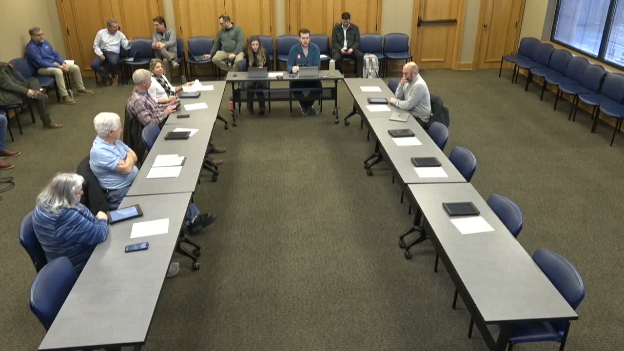 Commission reviews minor site‑plan change for Tesla chargers at EV Auto on Moores Lane