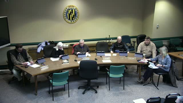 Applicant granted after‑the‑fact setback variance for existing garage; board cites hardship