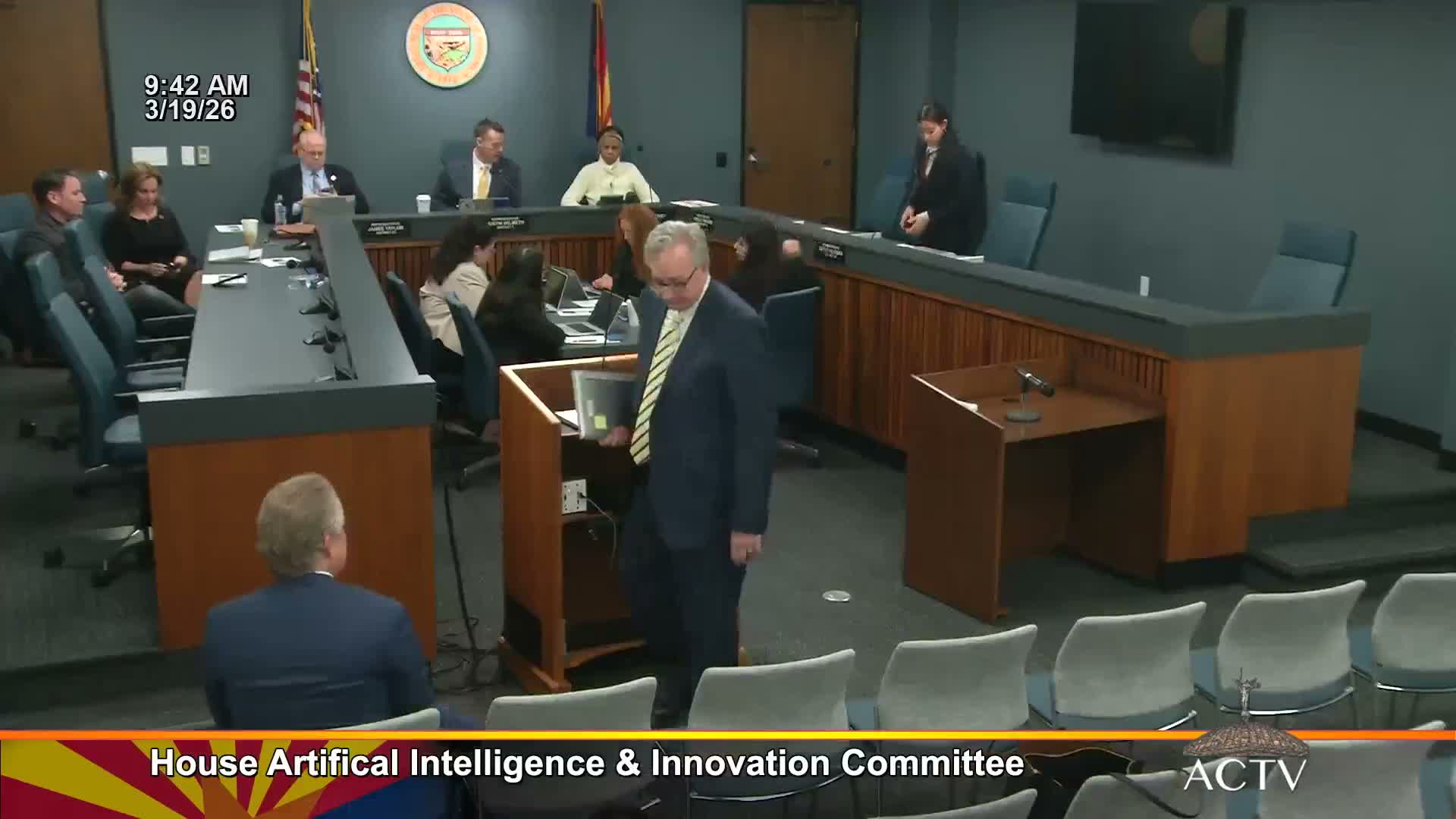 Company demo shows camera‑based AI for early smoke detection; committee asks about coverage and costs