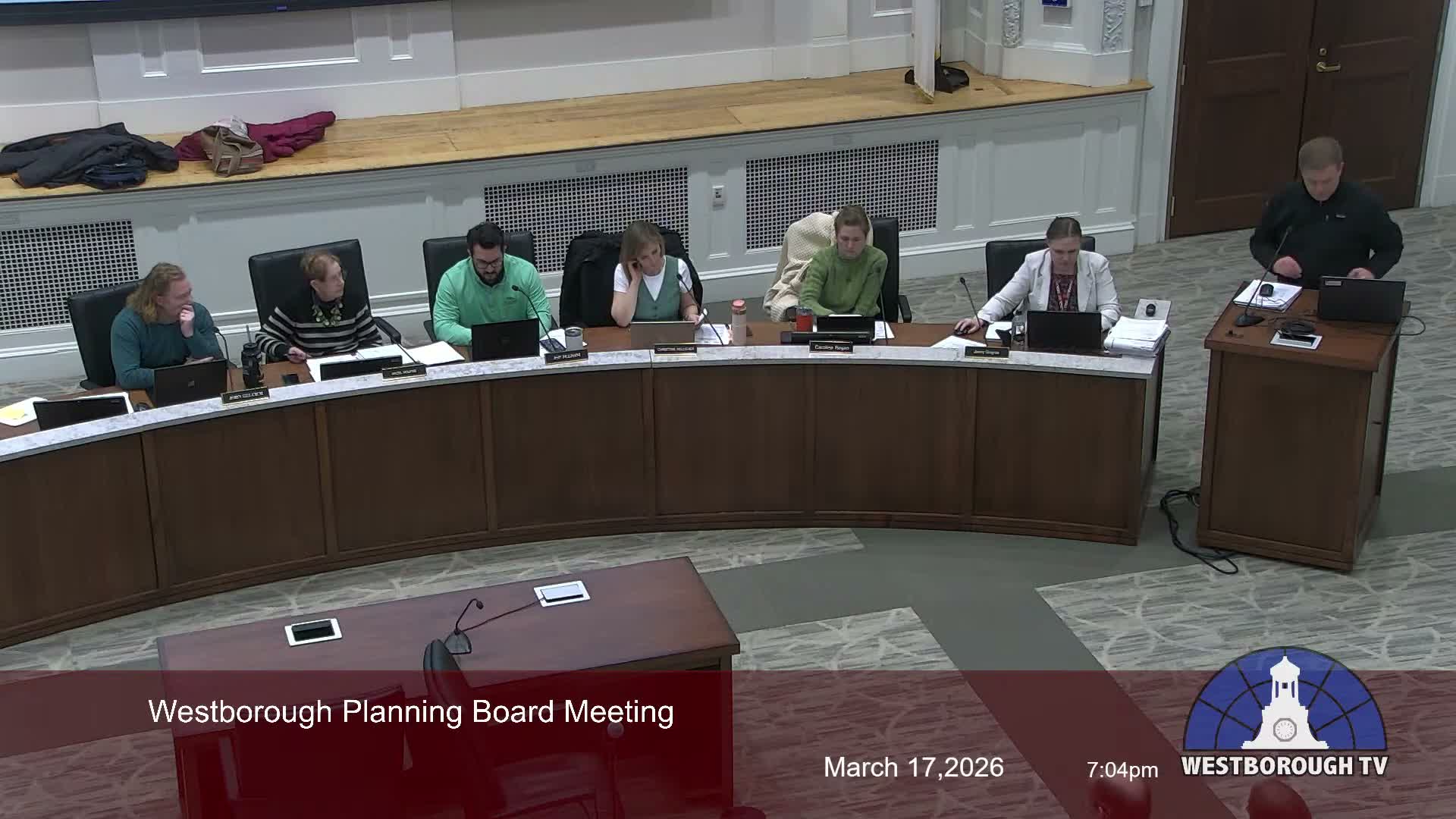 Neighbors press traffic, pedestrian-safety and screening concerns as planning board reviews Tennis & Swim Club proposal; hearing continued