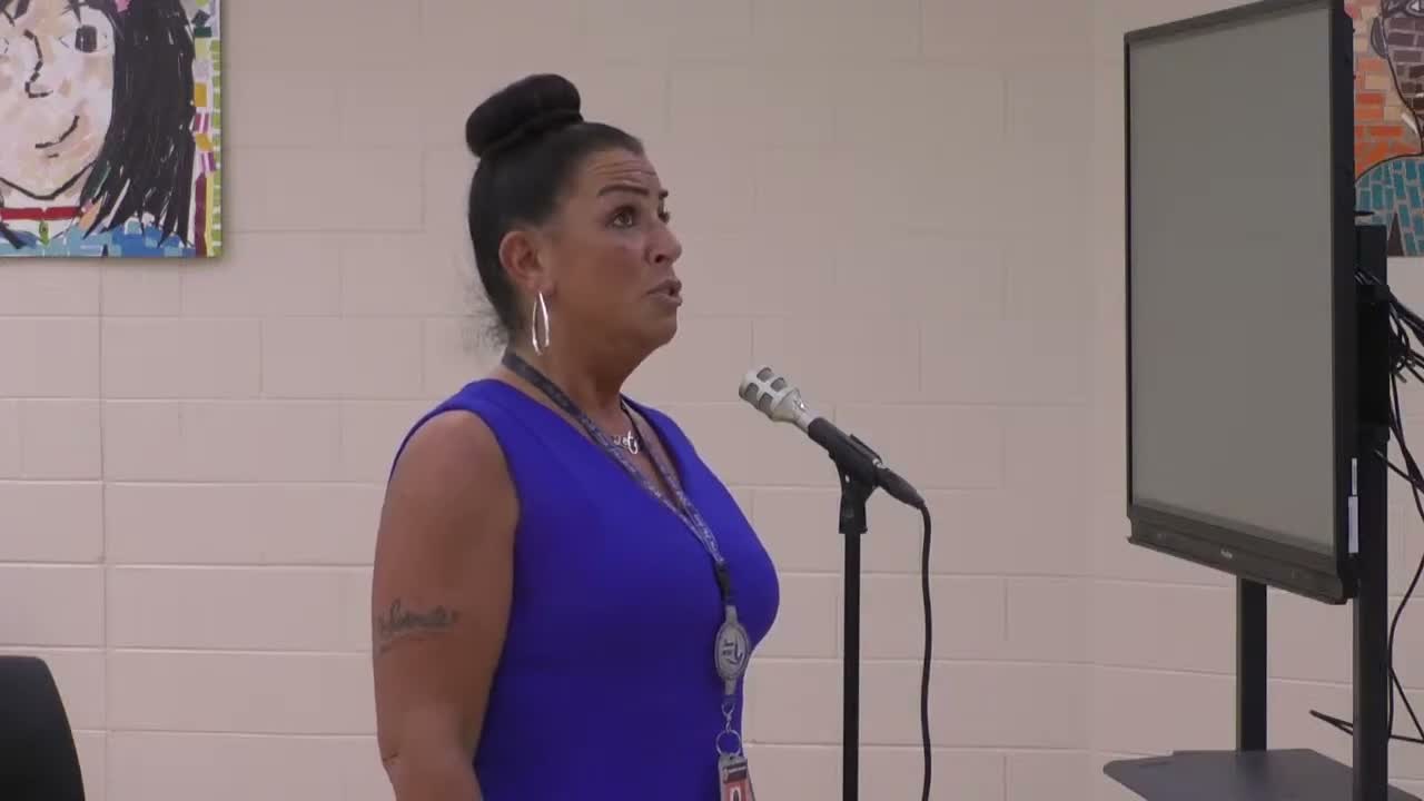 School staff presents partnership with National Giving Alliance to supply care packages to students in need