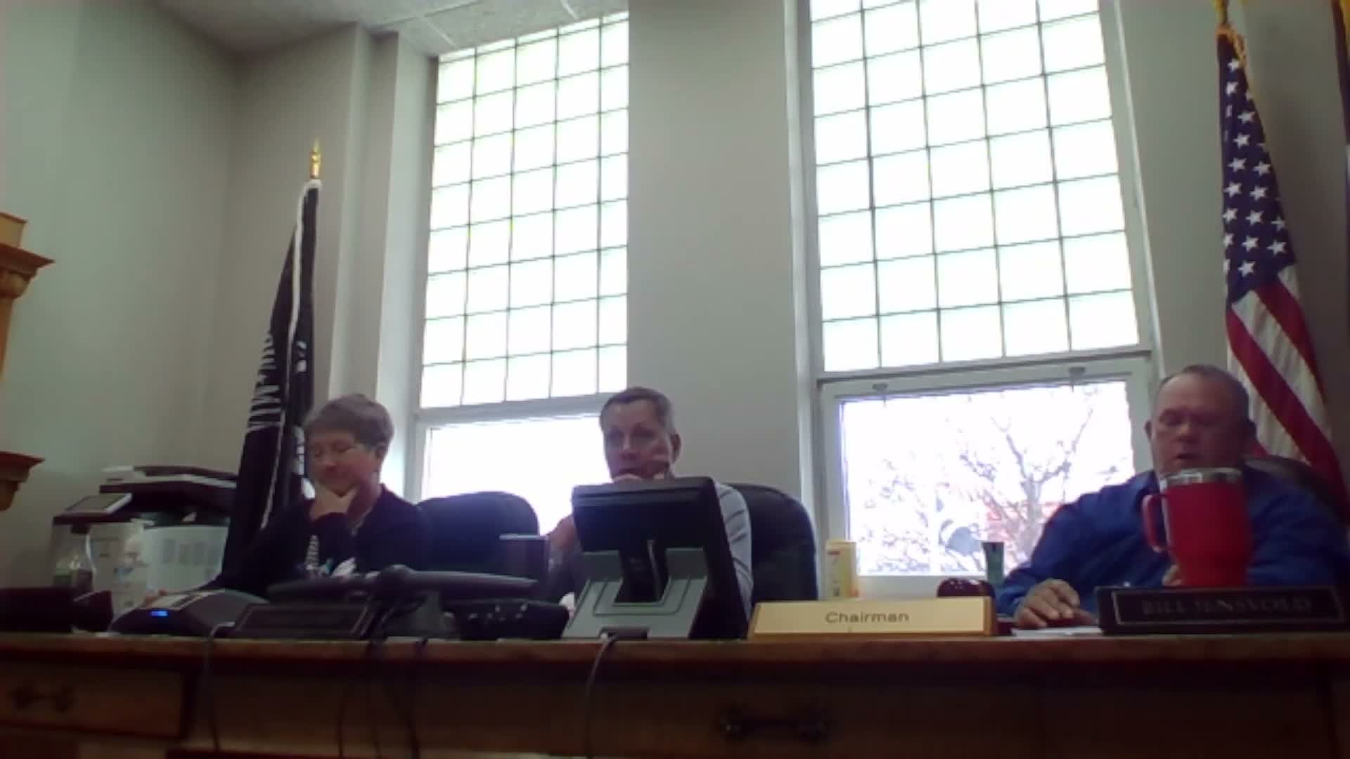 Board accepts bids and awards culvert/bridge contract; transcript shows inconsistent bid figure