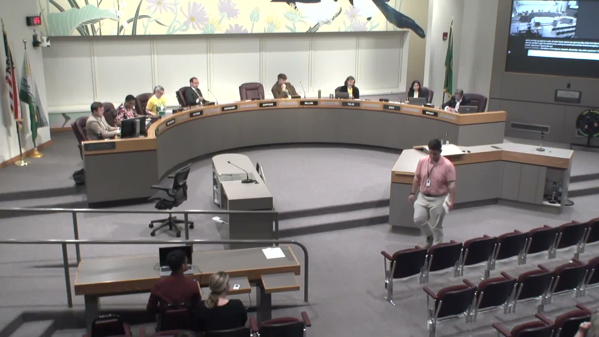 Council hears multiple funding items: $1.88M academy grant, FIFA event grant timing and a $2.1M purchase‑and‑sale for North Monroe